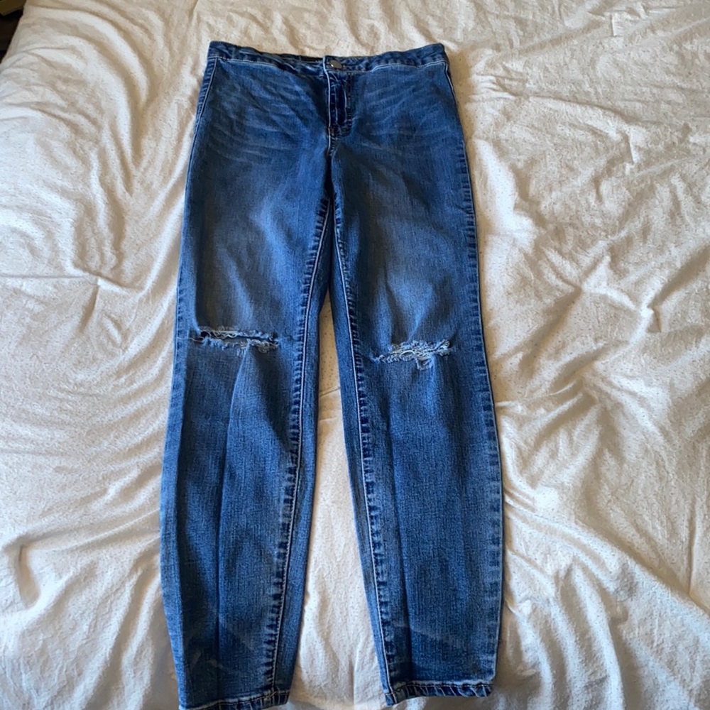 Washed look denim with ripped knee look